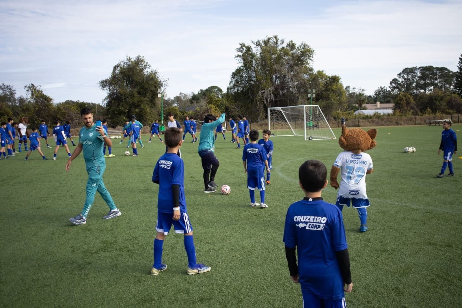 Training session on an open pitch with players and coaching staff at Cruzeiro Camp in Orlando